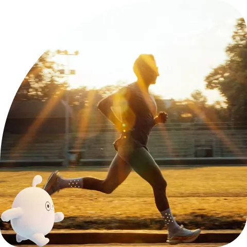 A runner at sunrise with Wooki cheering