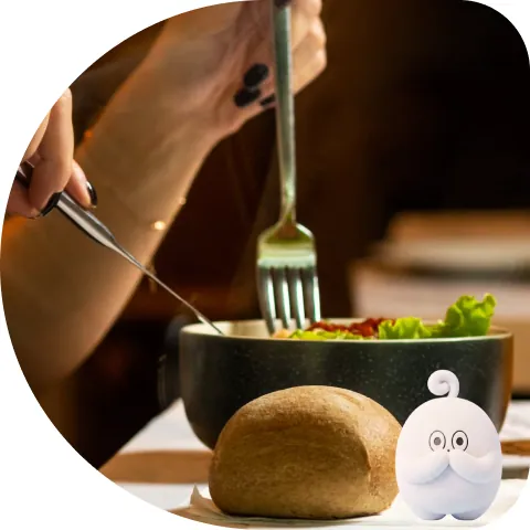 A healthy bowl and bread with a small Wooki